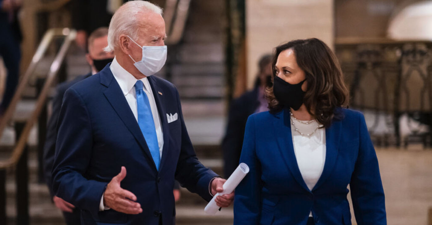 President Biden and Vice President Harris carry on a conversation.